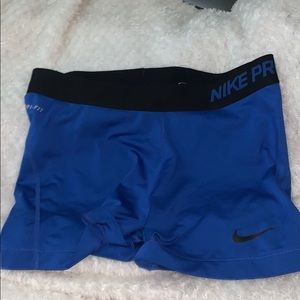 Large blue nike pro logo shorts